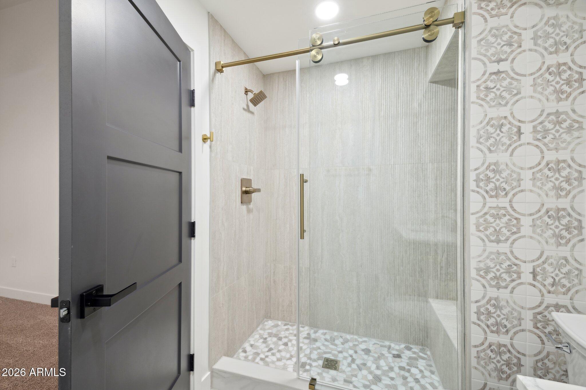 1216 West Rovey Avenue Phoenix, AZ 85013 - Photo 32 of 45 a bathroom with a shower and a sink