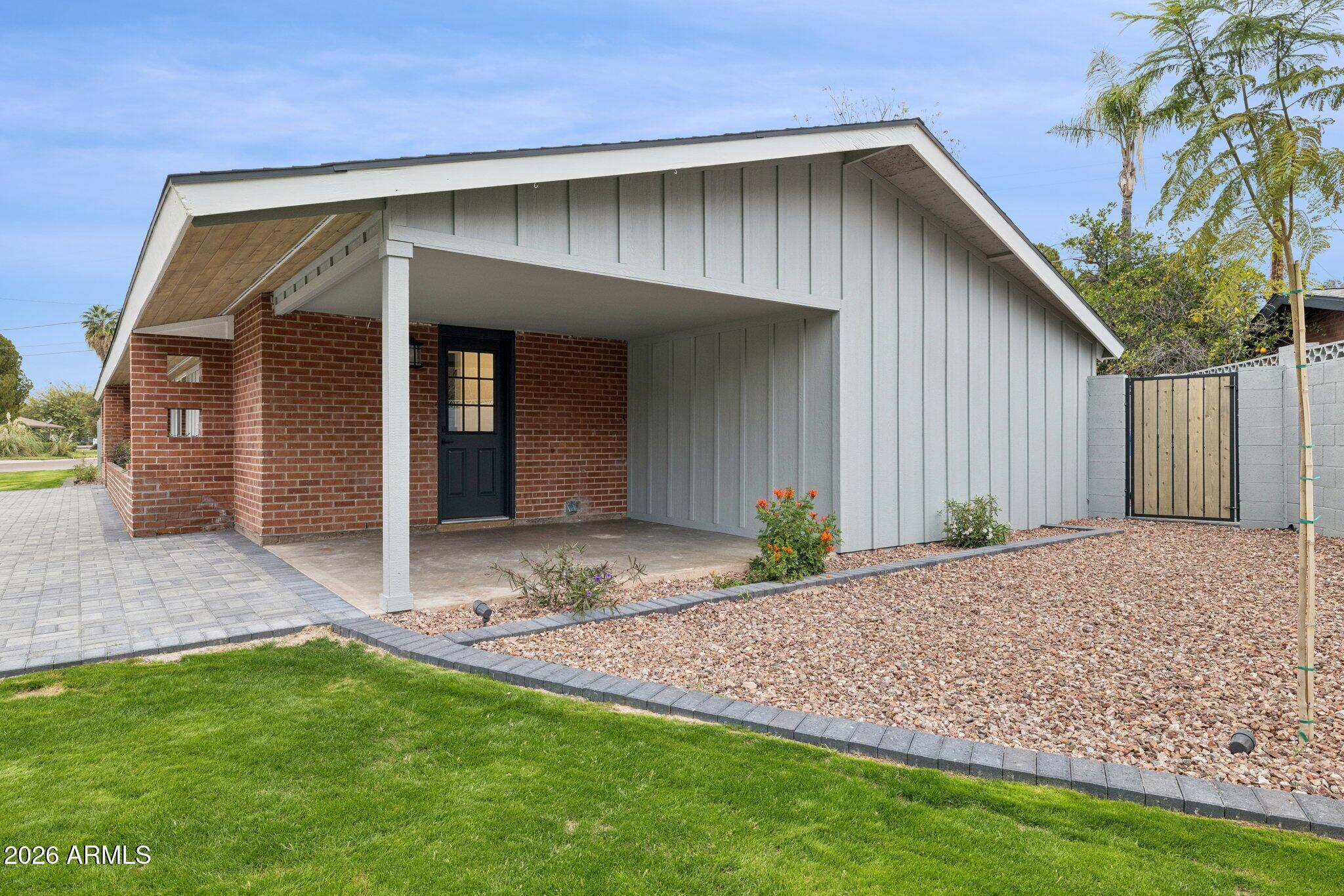 1216 West Rovey Avenue Phoenix, AZ 85013 - Photo 38 of 45 a front view of a house with garden
