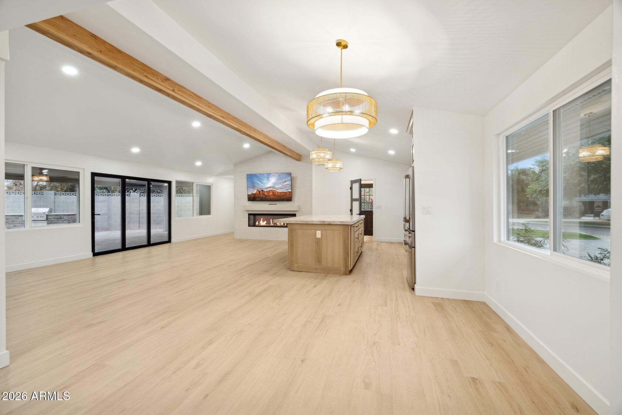 1216 West Rovey Avenue Phoenix, AZ 85013 - Photo 4 of 45 a view of a kitchen with a sink a refrigerator and a fireplace
