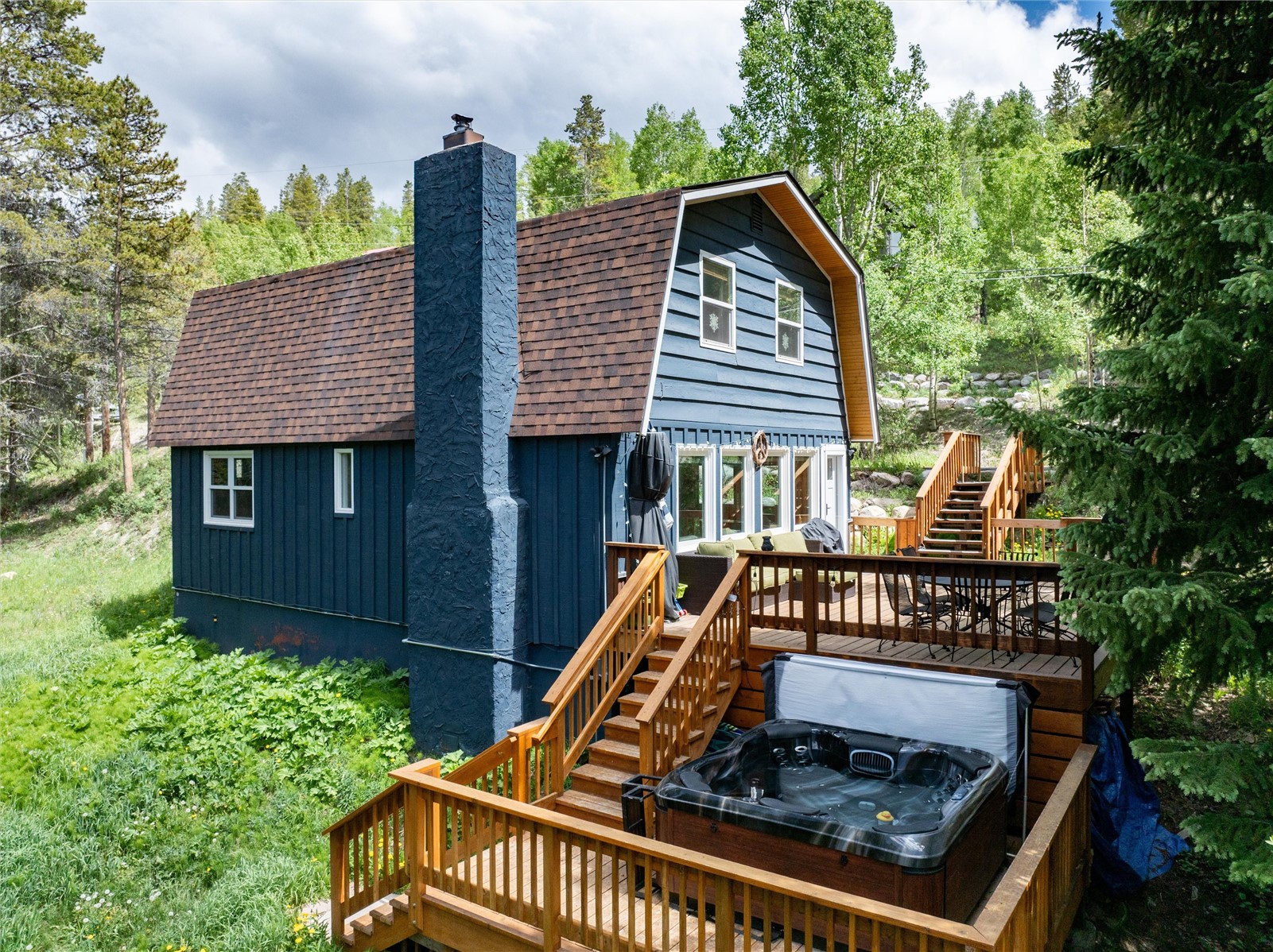 384 Blue Ridge Road Breckenridge, CO 80424 - Photo 15 of 39 a view of a roof deck with chair and wooden fence