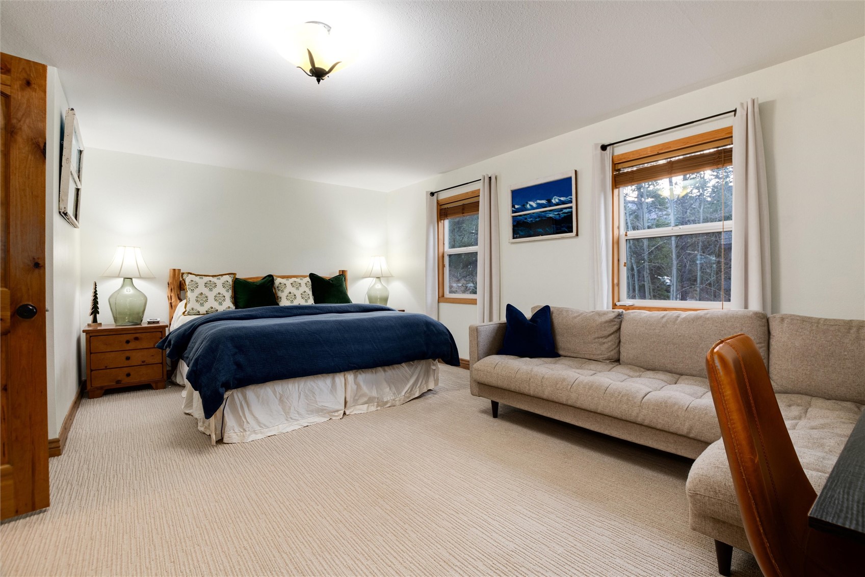384 Blue Ridge Road Breckenridge, CO 80424 - Photo 17 of 39 a bedroom with a bed a couch and a window