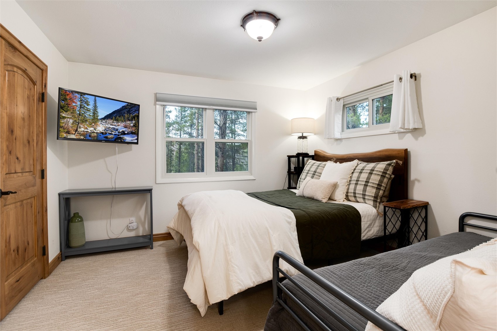 384 Blue Ridge Road Breckenridge, CO 80424 - Photo 19 of 39 a bedroom with a bed and a fireplace