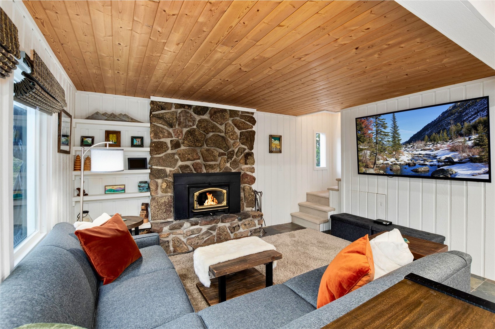 384 Blue Ridge Road Breckenridge, CO 80424 - Photo 2 of 39 a living room with furniture and a fireplace