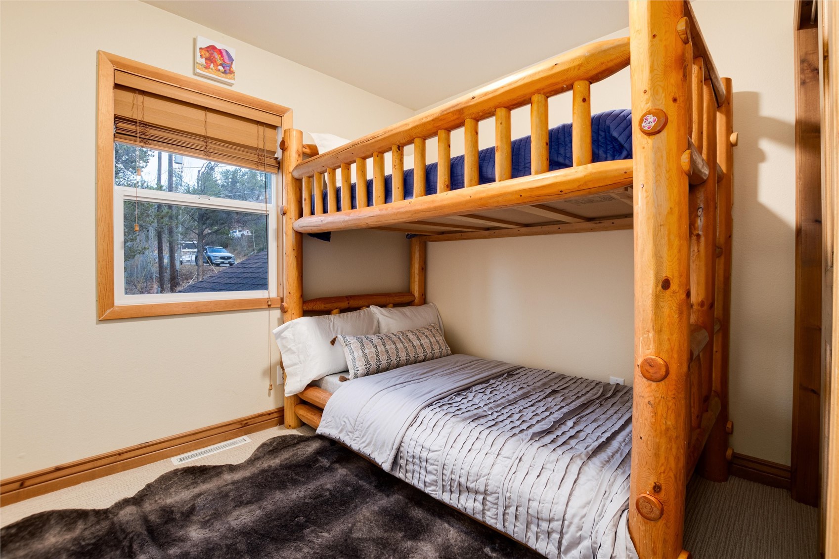 384 Blue Ridge Road Breckenridge, CO 80424 - Photo 21 of 39 a bedroom with a bed and a window