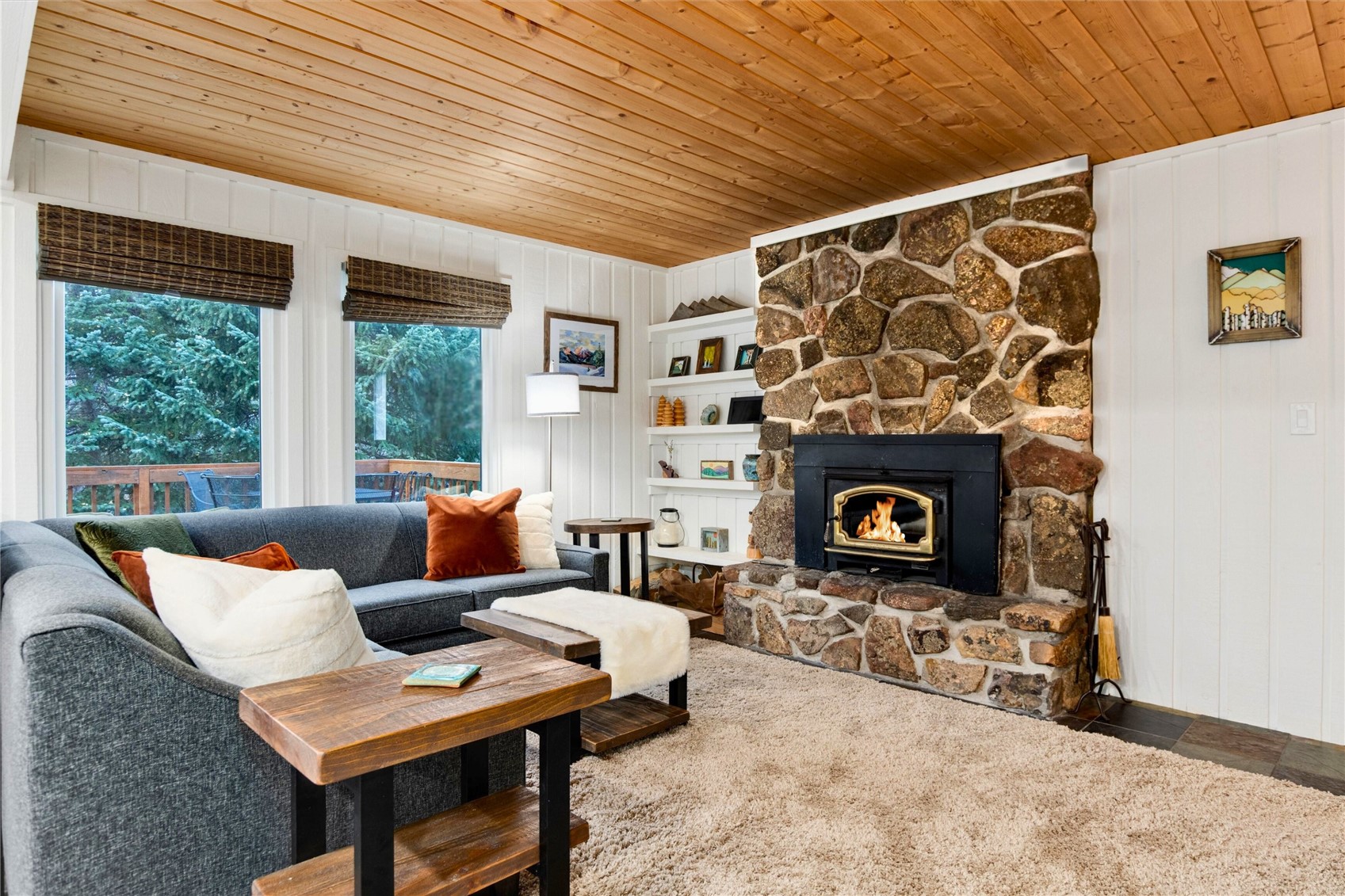 384 Blue Ridge Road Breckenridge, CO 80424 - Photo 3 of 39 a living room with furniture and a fireplace