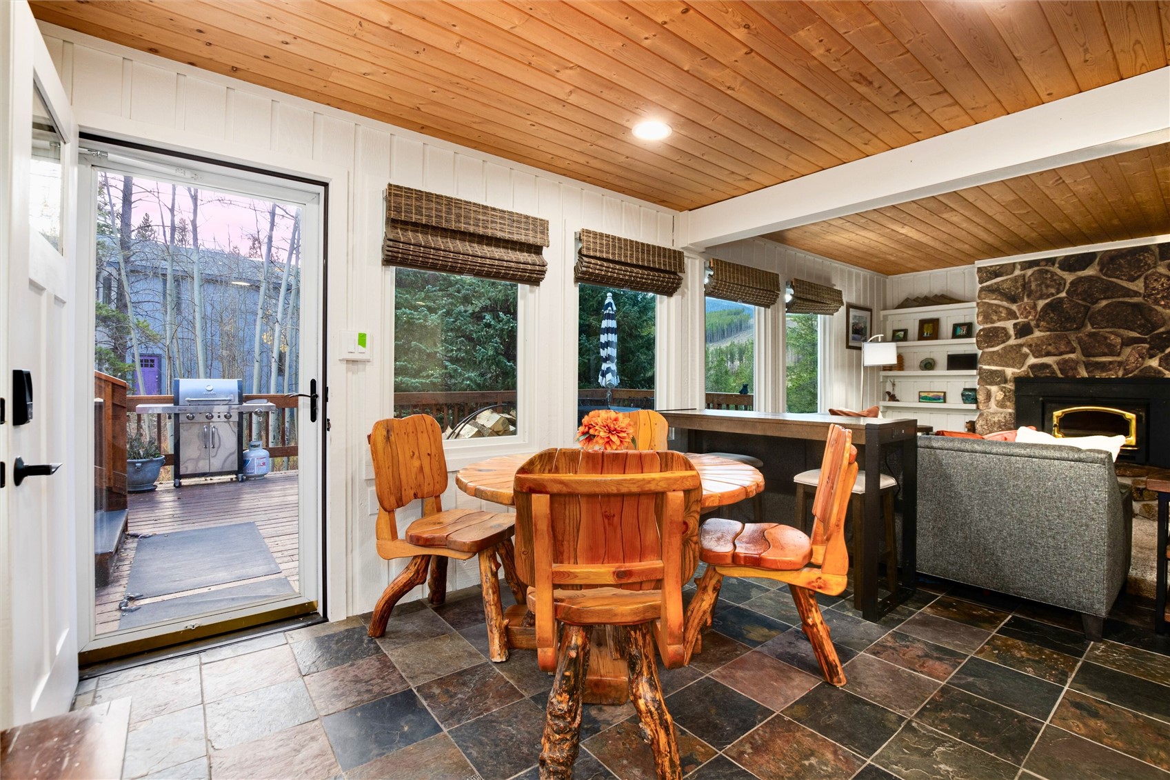 384 Blue Ridge Road Breckenridge, CO 80424 - Photo 9 of 39 a dining room with furniture and large windows