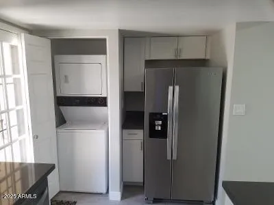 a room with refrigerator and window