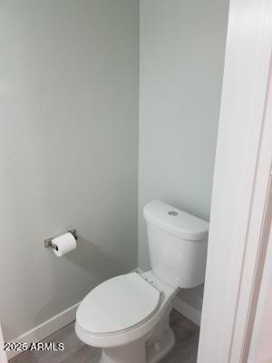 3719 East Inverness Avenue, Unit 91 Mesa, AZ 85206 - Photo 15 of 28 a white toilet sitting next to a shower