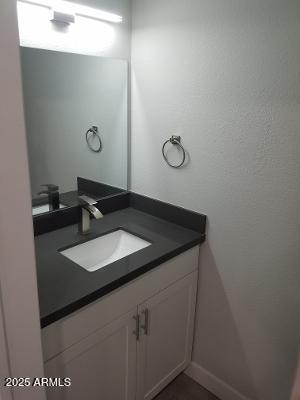 3719 East Inverness Avenue, Unit 91 Mesa, AZ 85206 - Photo 16 of 28 a bathroom with a sink and a mirror