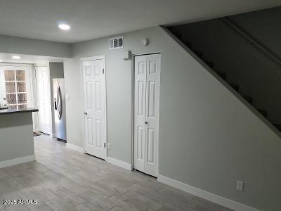 3719 East Inverness Avenue, Unit 91 Mesa, AZ 85206 - Photo 17 of 28 an empty room with windows