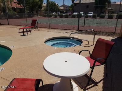 3719 East Inverness Avenue, Unit 91 Mesa, AZ 85206 - Photo 26 of 28 a swimming pool with outdoor seating