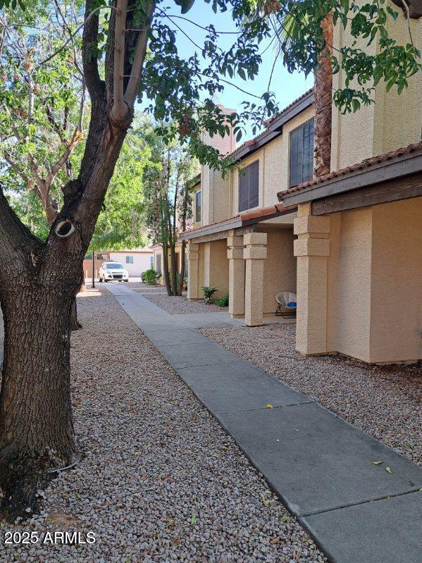 3719 East Inverness Avenue, Unit 91 Mesa, AZ 85206 - Photo 28 of 28 a view of a house with a tree in front