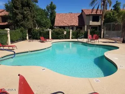 a view of a swimming pool with a patio
