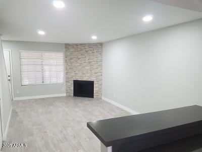 3719 East Inverness Avenue, Unit 91 Mesa, AZ 85206 - Photo 6 of 28 an empty room with windows