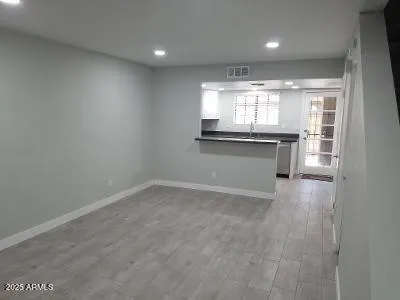 a view of an empty room with a window