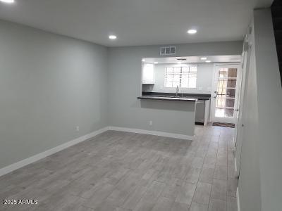 3719 East Inverness Avenue, Unit 91 Mesa, AZ 85206 - Photo 8 of 28 a view of an empty room with a window