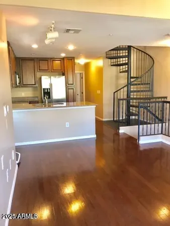a view of kitchen and dining room with wooden floor