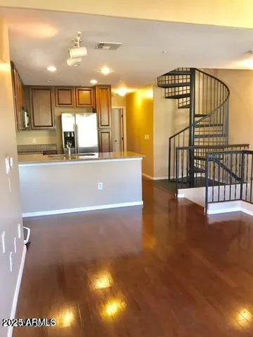 a view of kitchen and dining room with wooden floor