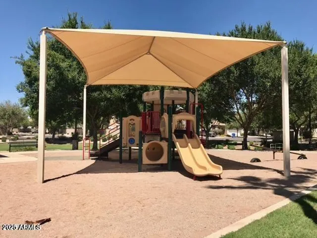 a view of a swimming pool with sitting area and furniture