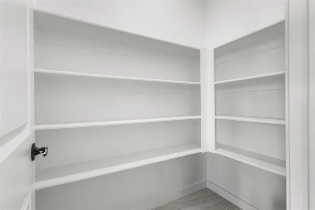 a large bathroom with a sink and mirror