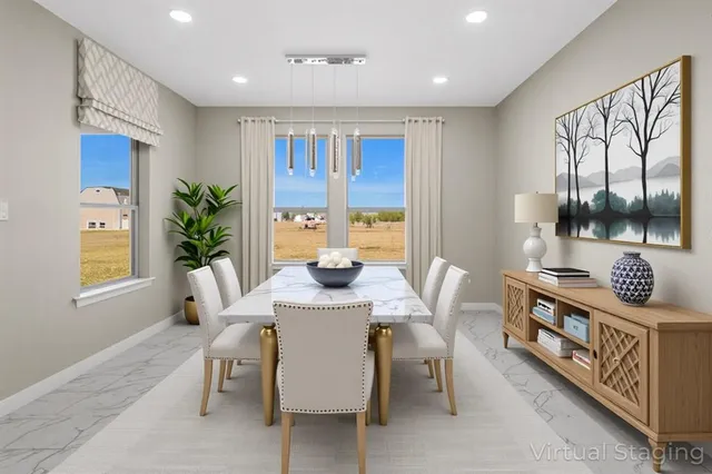 a spacious bedroom with a large bed and a chandelier