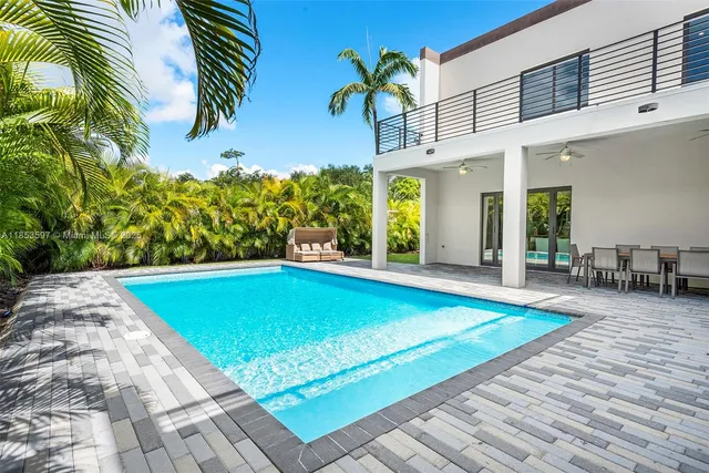 a bedroom with a bed and a chair