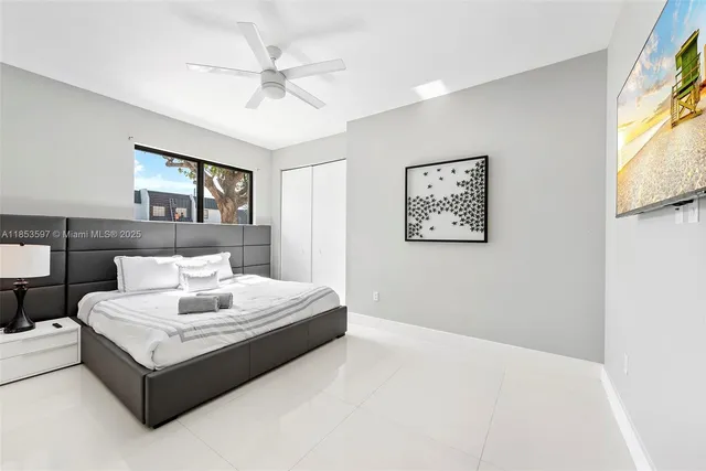 a bedroom with a bed and window