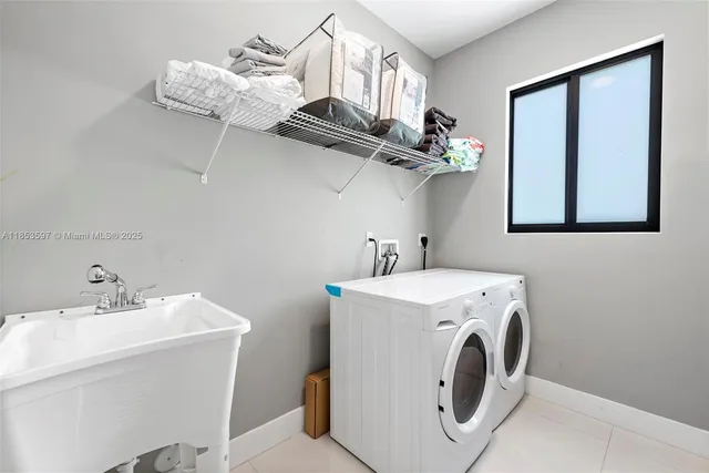 a front view of a house with a garden and yard