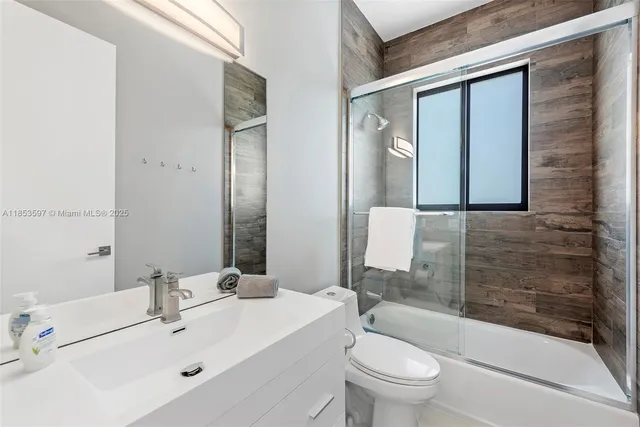 a view of a house with swimming pool and sitting area