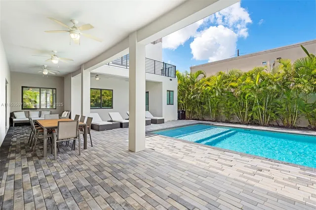 a living room with a couch and windows