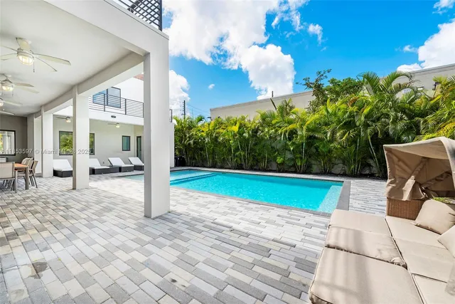 a living room with furniture and a couch