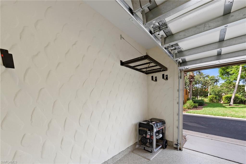 9076 Rialto Street, Unit 6204 Naples, FL 34113 - Photo 30 of 50 NEW DEDICATED GENERATOR OUTLET (2024), NEW HEAVY DUTY EPOXY FLOOR (2024), NEW HANGING STORAGE SHELVES (2021), NEW GENERATOR (2016)
