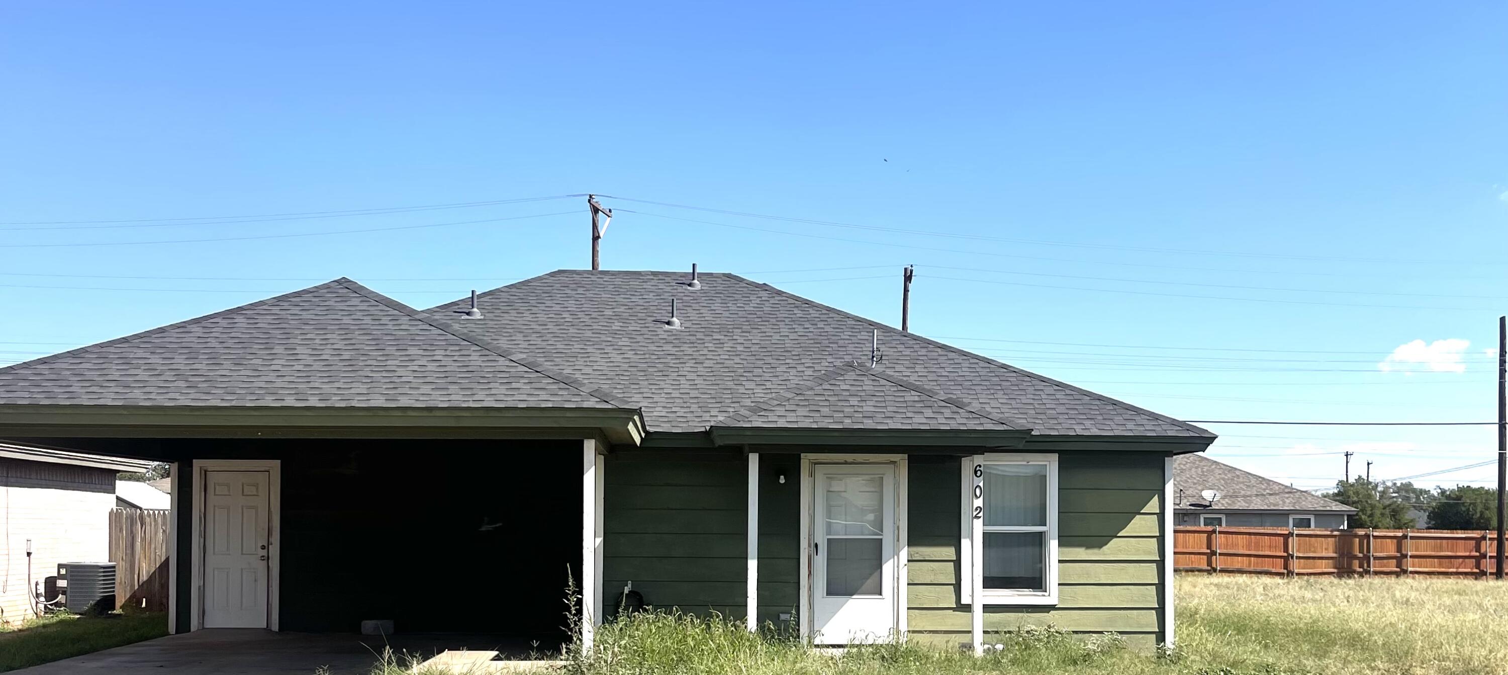 a house view with a garden space