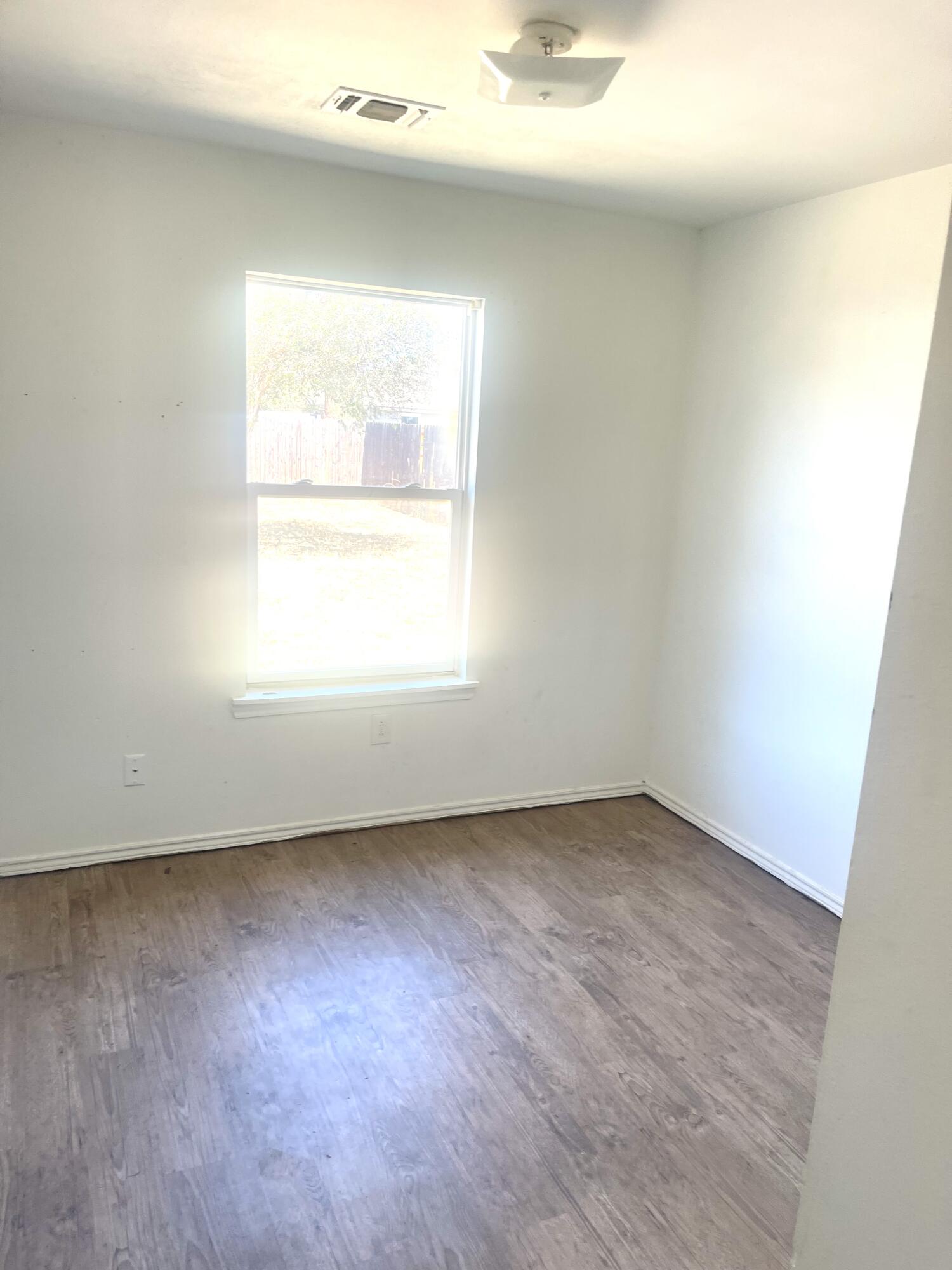 602 43rd Street Lubbock, TX 79404 - Photo 7 of 8 an empty room with a window