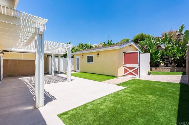 a house with garden in front of it