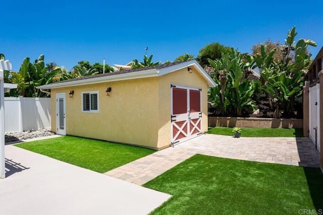 a view of a backyard with a garden