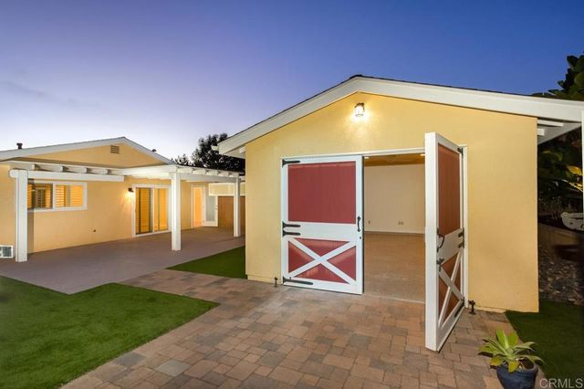 a view of front of house with a yard