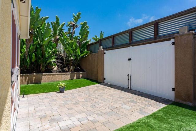 a view of backyard with potted plants