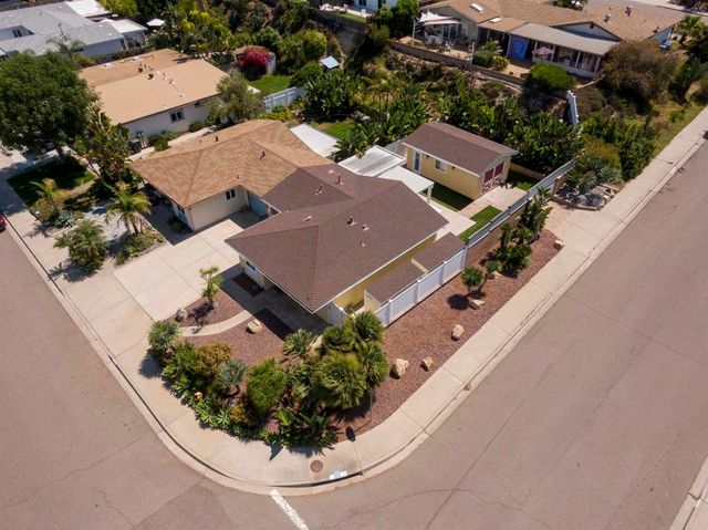 an aerial view of a house with a garden