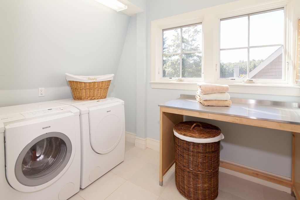 86 Pickwick Road Newton, MA 02465 - Photo 12 of 16 a utility room with dryer and washer