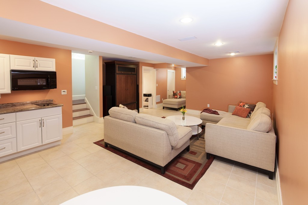 86 Pickwick Road Newton, MA 02465 - Photo 13 of 16 a living room with furniture and a flat screen tv