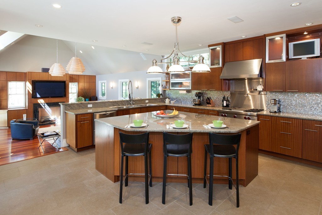 86 Pickwick Road Newton, MA 02465 - Photo 3 of 16 a room with stainless steel appliances kitchen island a table and chairs in it