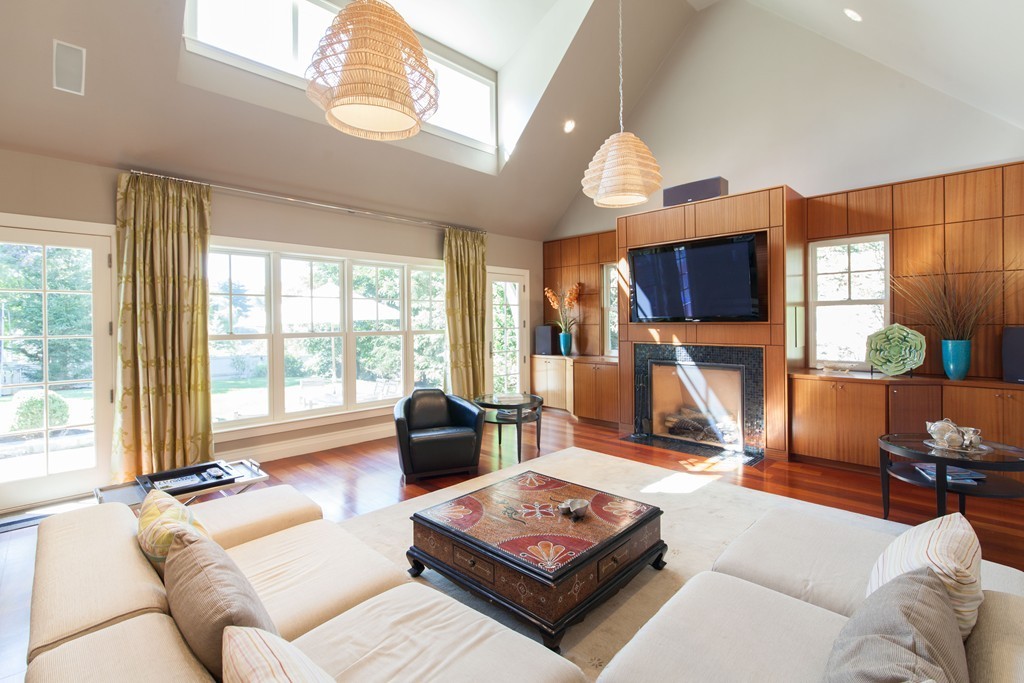 86 Pickwick Road Newton, MA 02465 - Photo 4 of 16 a living room with furniture a flat screen tv and a large window