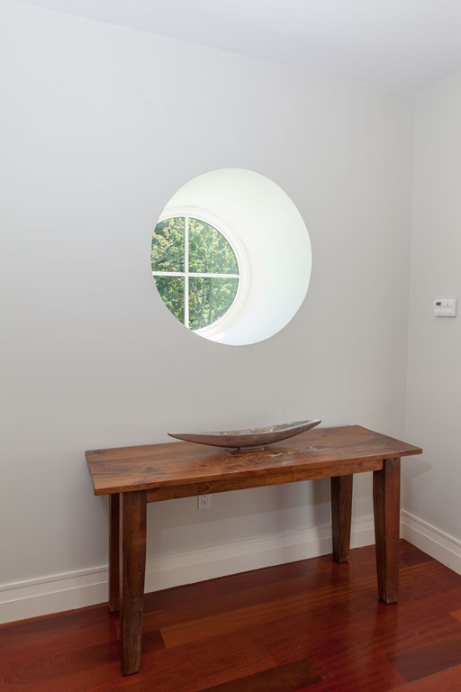 86 Pickwick Road Newton, MA 02465 - Photo 8 of 16 a room with a table and potted plant