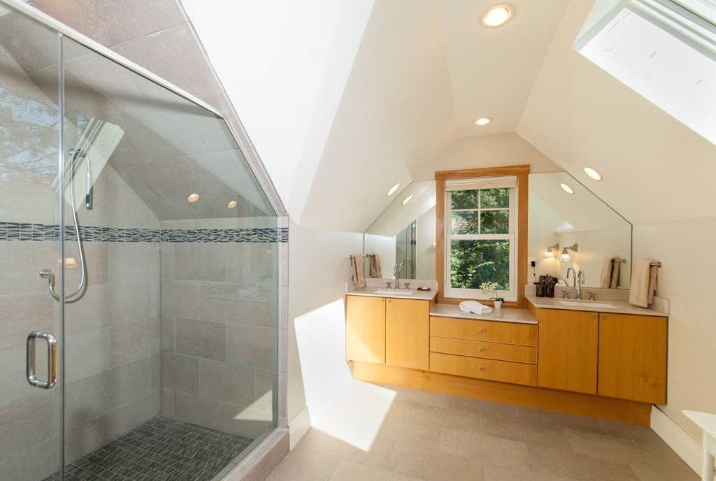 86 Pickwick Road Newton, MA 02465 - Photo 10 of 16 a large bathroom with a tub a mirror a sink and glass door