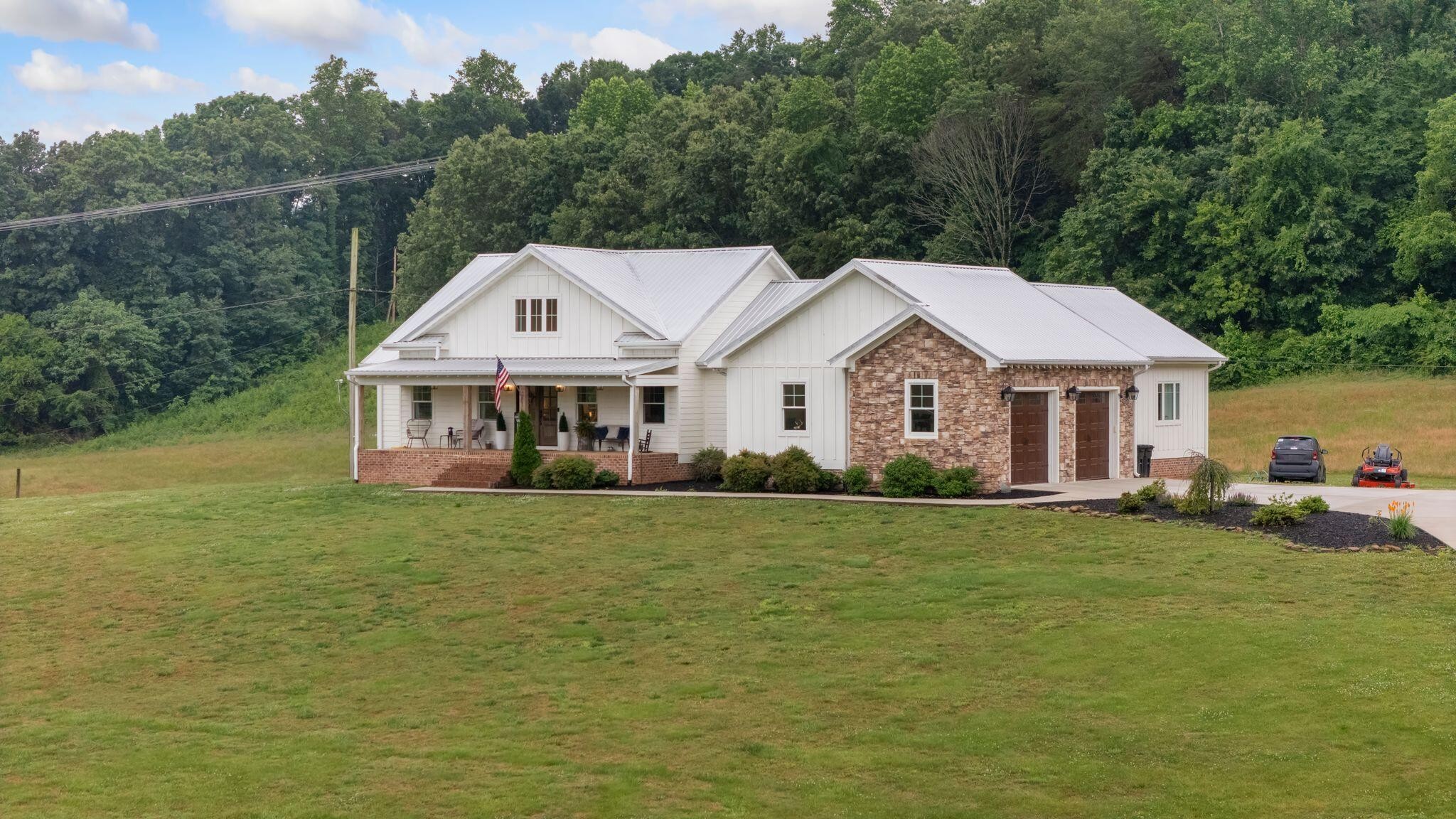 6866 Daus Mountain Road Whitwell, TN 37397 - Photo 45 of 49 a front view of a house with a garden