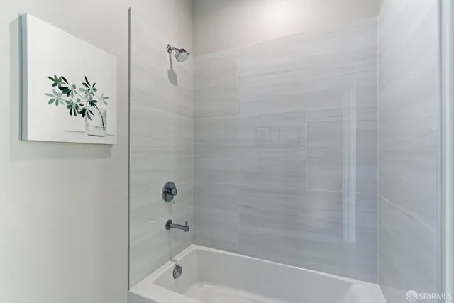 a kitchen with stainless steel appliances granite countertop a stove and a refrigerator