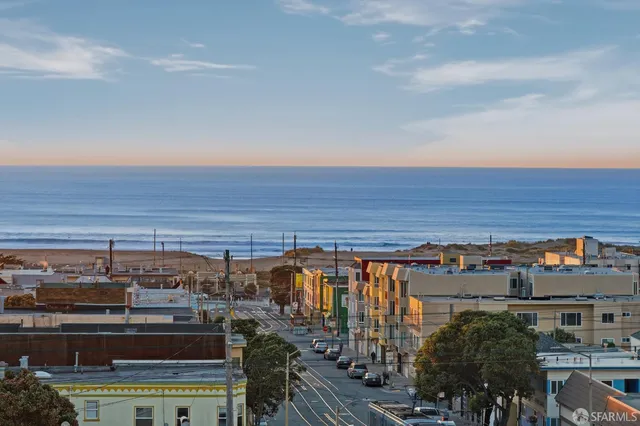 a balcony with furniture and city view