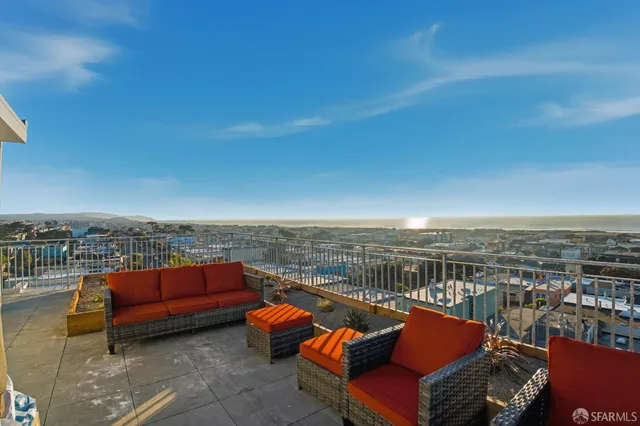 a view of roof deck with patio