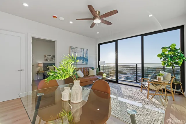 a living room with furniture a window and kitchen view